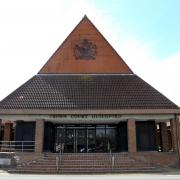 The trial is being heard at Guildford Crown Court (Gareth Fuller/PA)